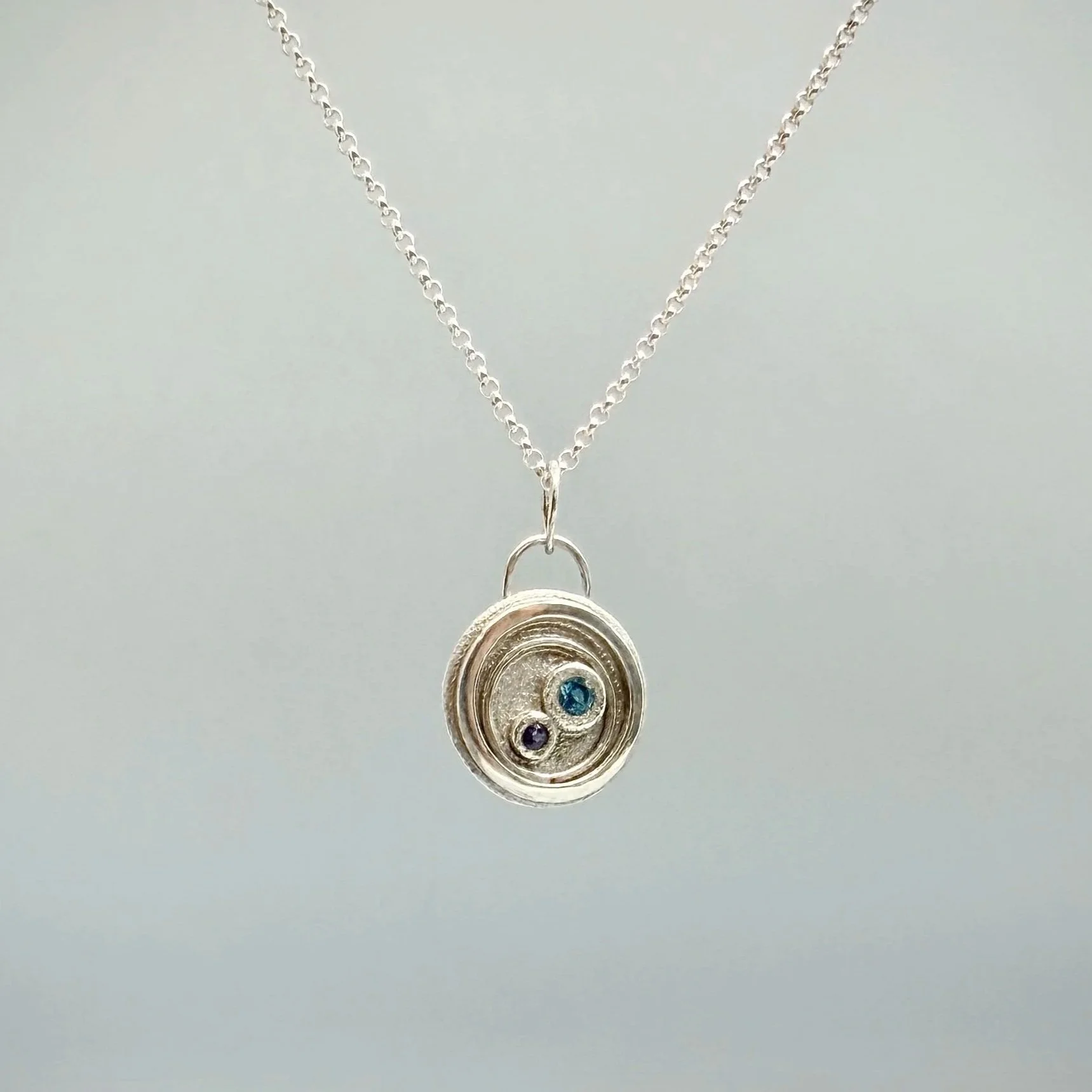 Modern Silver Coin Pendant with Topaz and Tanzanite