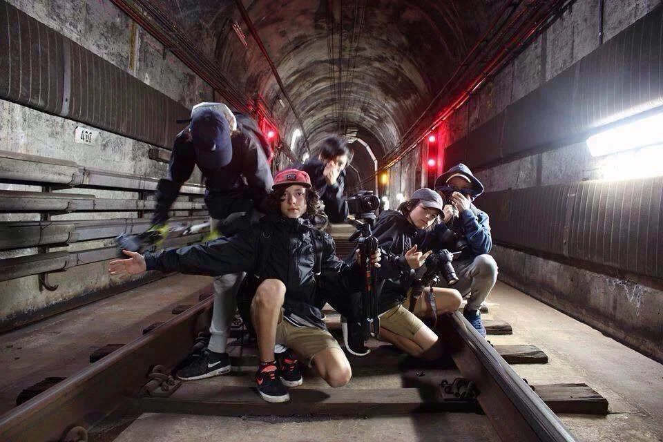 Pictured: The Chino Shorts Gang who don't seem to understand that covering your face only works when everyone does it.
