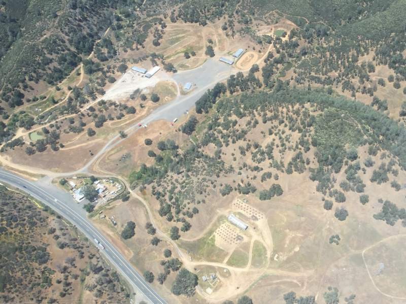 Aerial view shows how illegal pot growers clear areas and cut down trees in mountains of northern California. This view is in Lake County