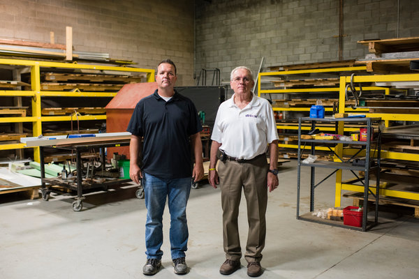 Chris Cruciger and his father, Bill, in the shop at Roof Rite, a roofing company in Youngstown, Ohio. Chris Cruciger said, “We could take on twice as many projects if we had more suitable workers.”