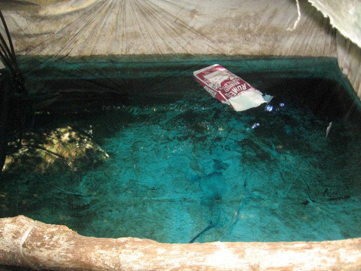 Blue tinted water with fertilizer at an illegal marijuana growing site in Mendocino County, California is pictured in this undated handout photo obtained by Reuters July 25, 2017. California Department of Fish and Wildlife/Handout via REUTERS