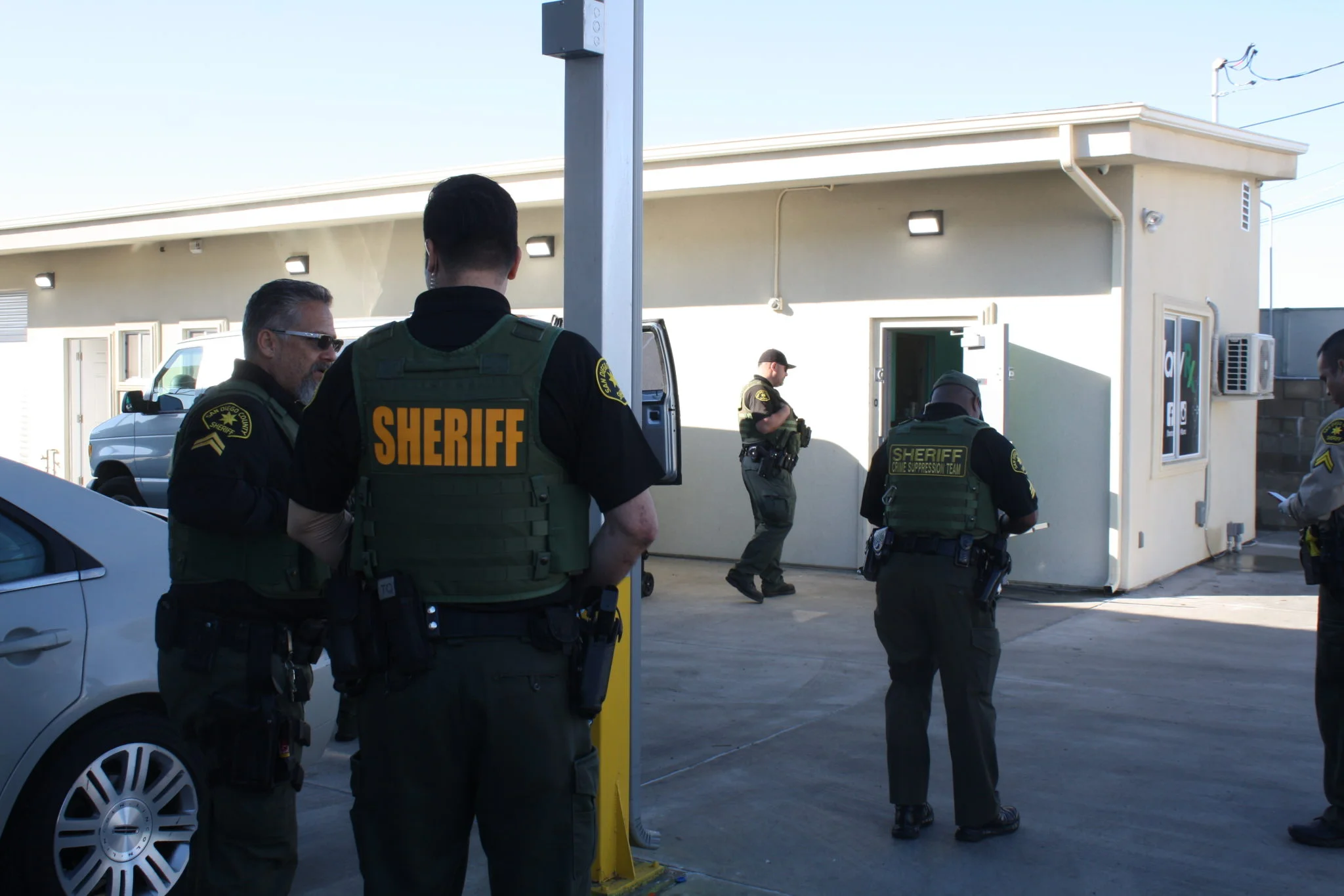 San Diego County Sheriff’s Department deputies raid an illegal dispensary in Spring Valley. / Photo by Kinsee Morlan