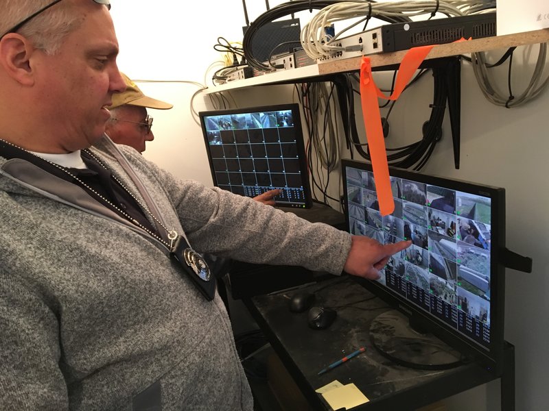 Officer Steve Morehead, of the Washington State Liquor and Cannabis Board, does a spot check on the required video surveillance system at a licensed pot grower near Brewster, on the Columbia River.