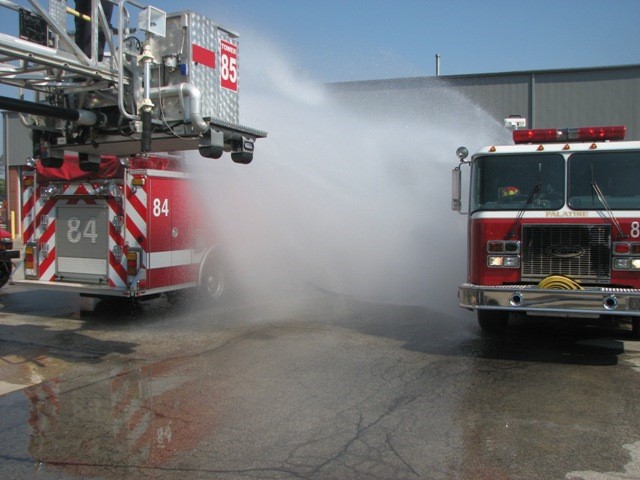 Figure 6 - A Mass Decontamination set up with two pumper trucks and an aerial spray. (Source: Village of Palatine, Illinois)