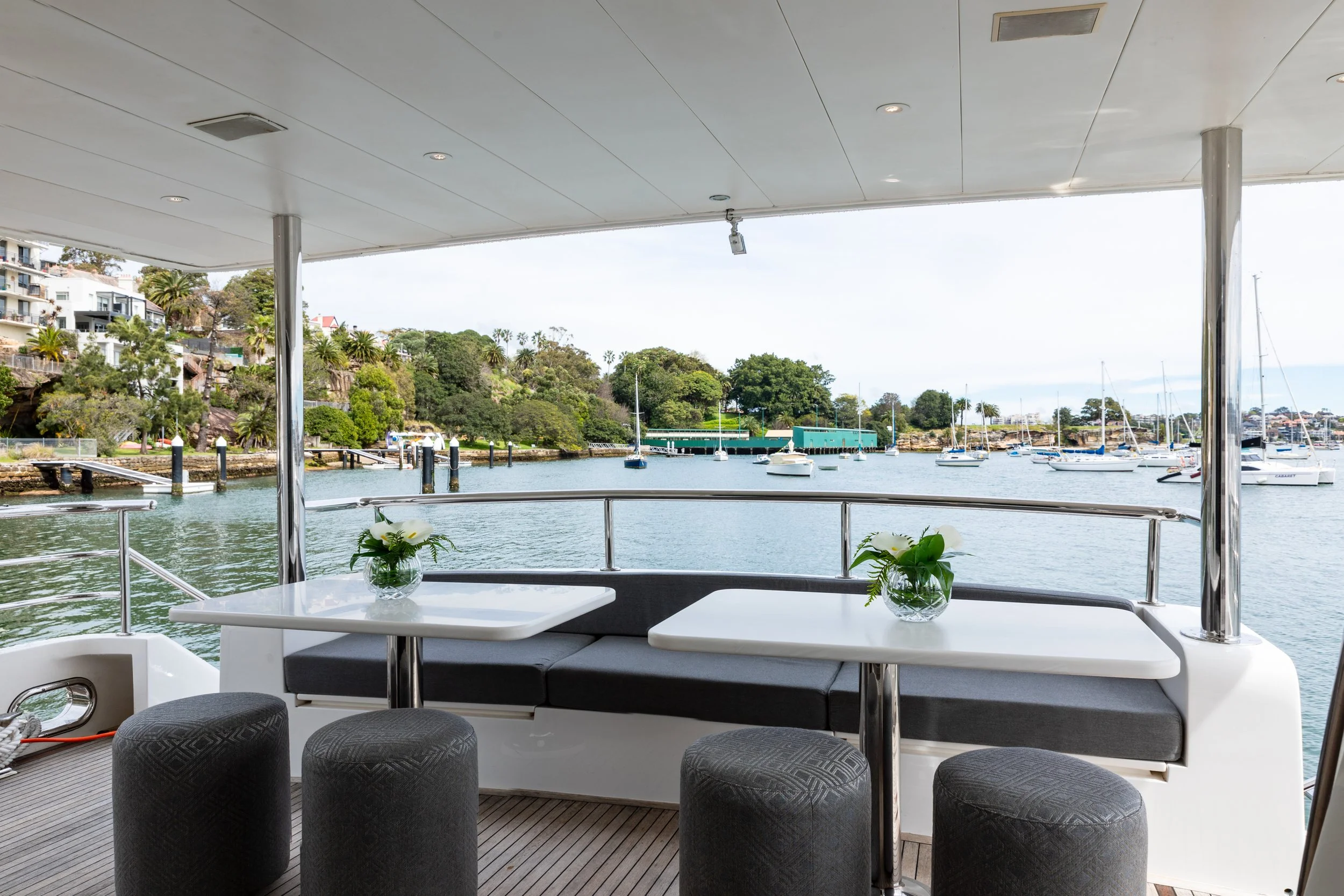 Two Corian tables at the stern of a boat