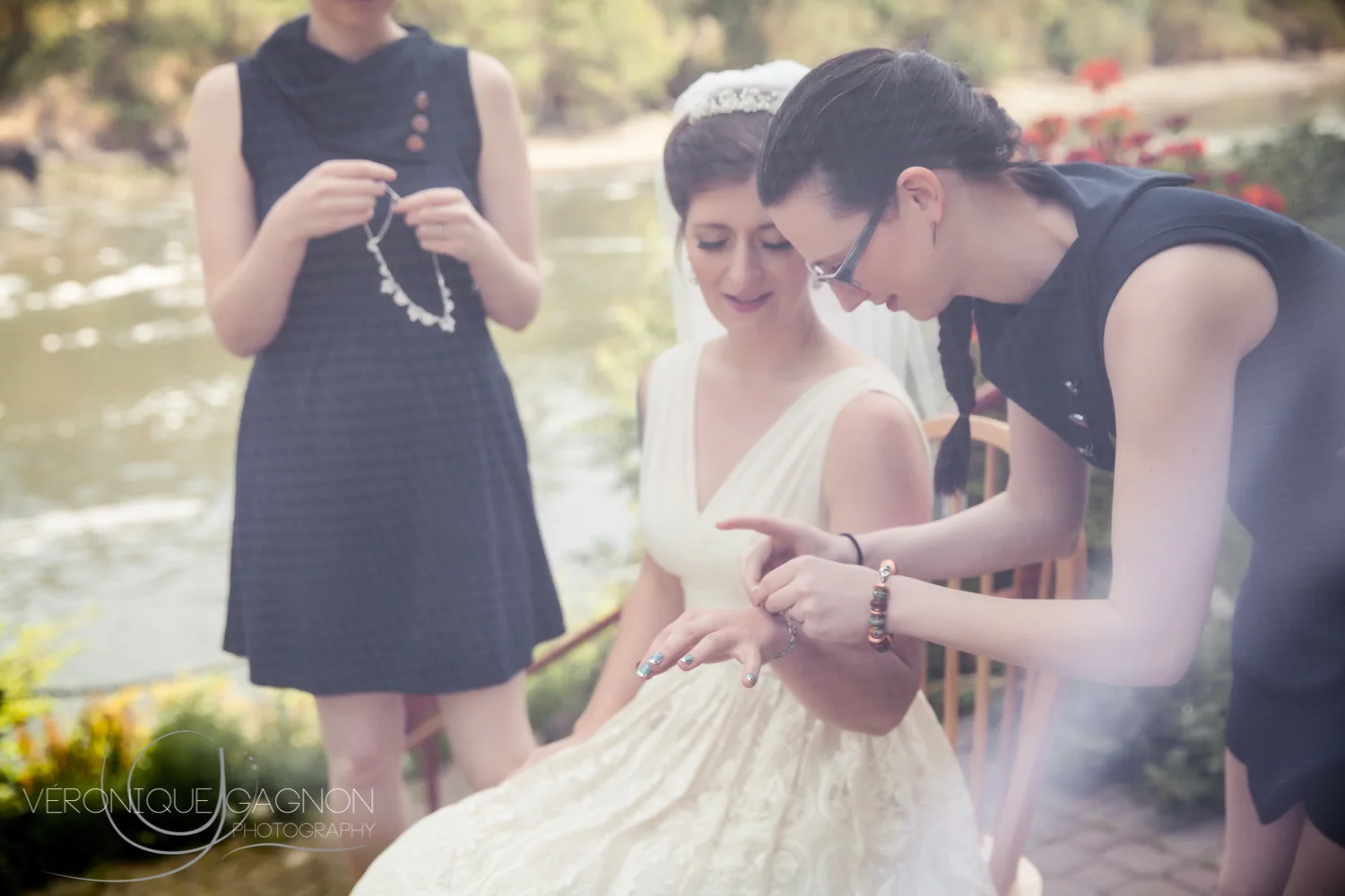 Bridesmaids helping the bride getting ready along the Gorge Waterway .