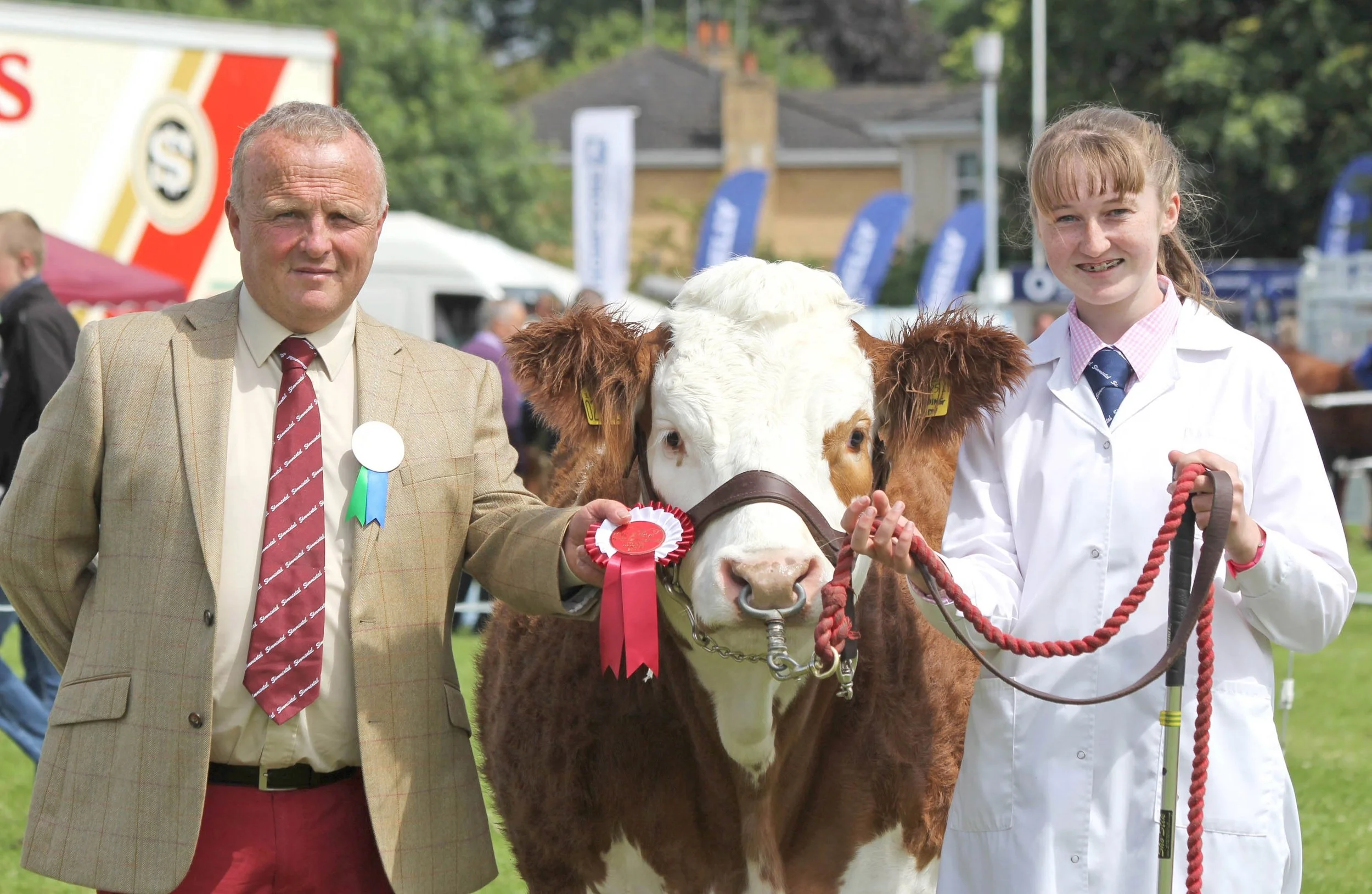 Molly Bradley, Armagh, was the winner of the senior young handler class at the NI National Simmental Show. Included is British Simmental Cattle Society Michael Barlow who judged at the Omagh event.