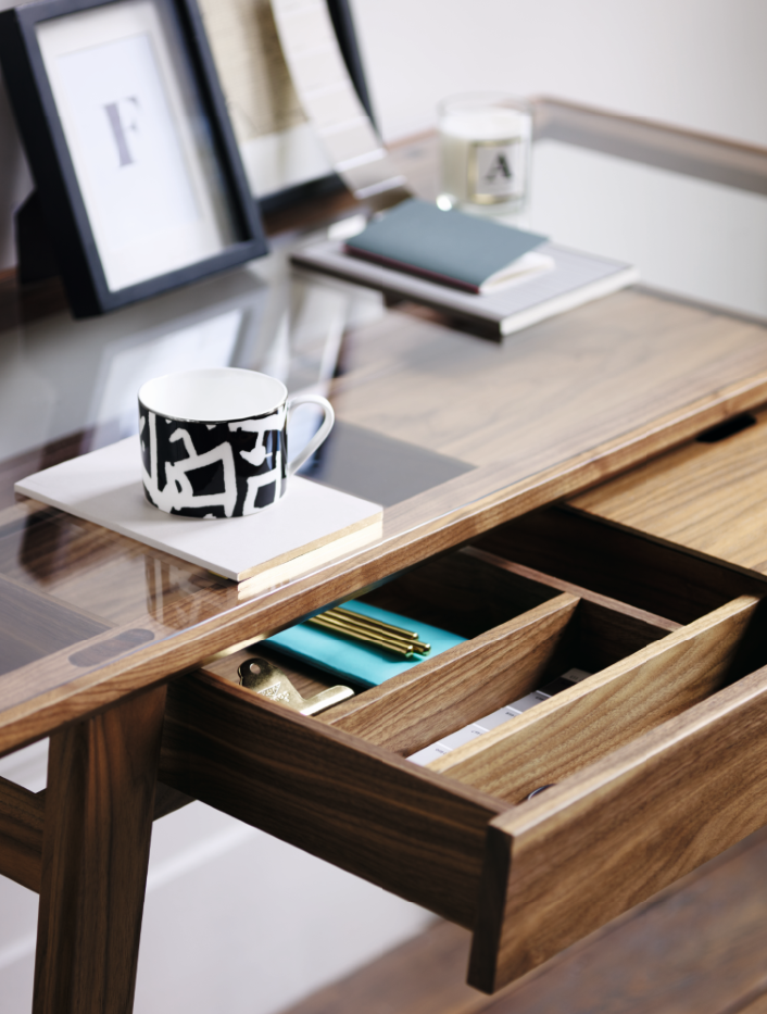The glass top allows the user to see through into the drawer compartments below