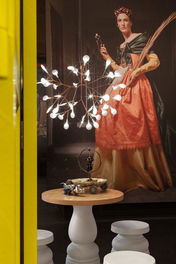 Moooi's Heracleum light hangs above Container stools and a Container table from the New Antiques collection . Photo: Peer Lindgreen