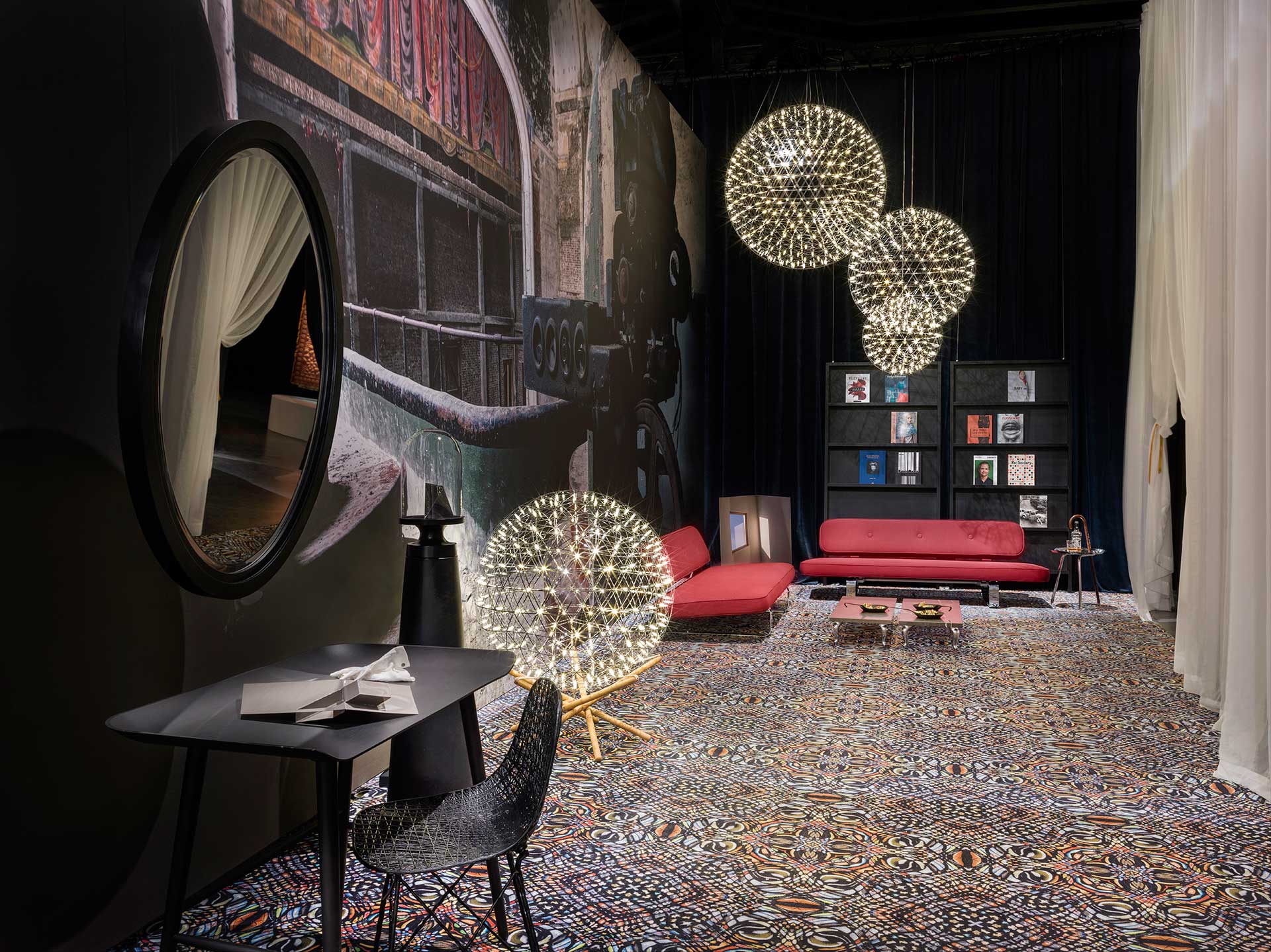 A cluster of Moooi's Raimond lights sparkle against the darkness in Moooi's 2016 Milan exhibit. Photo Andrew Meredith for Moooi.