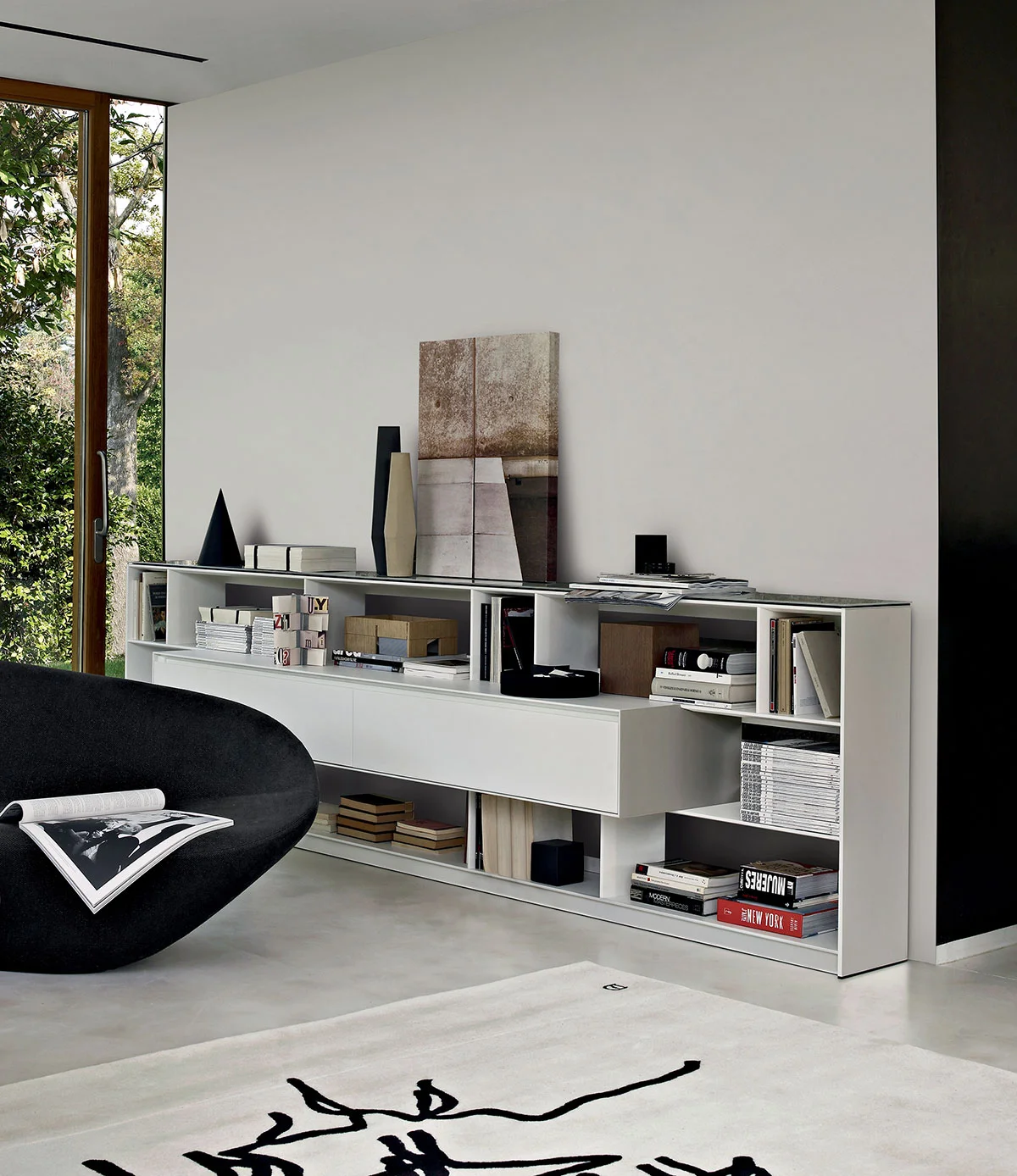 The Flat C storage system by Antonio Citterio for B&B Italia was designed to house entertainment systems and books in the smallest space possible. 