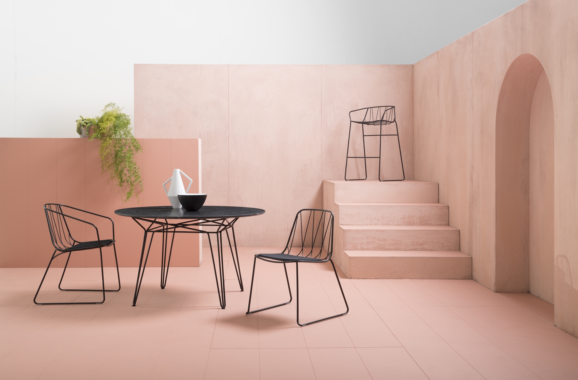 The Chee chair collection and Parisi table in Black Marquina marble from SP01 Outdoor. Photo: Jason Busch