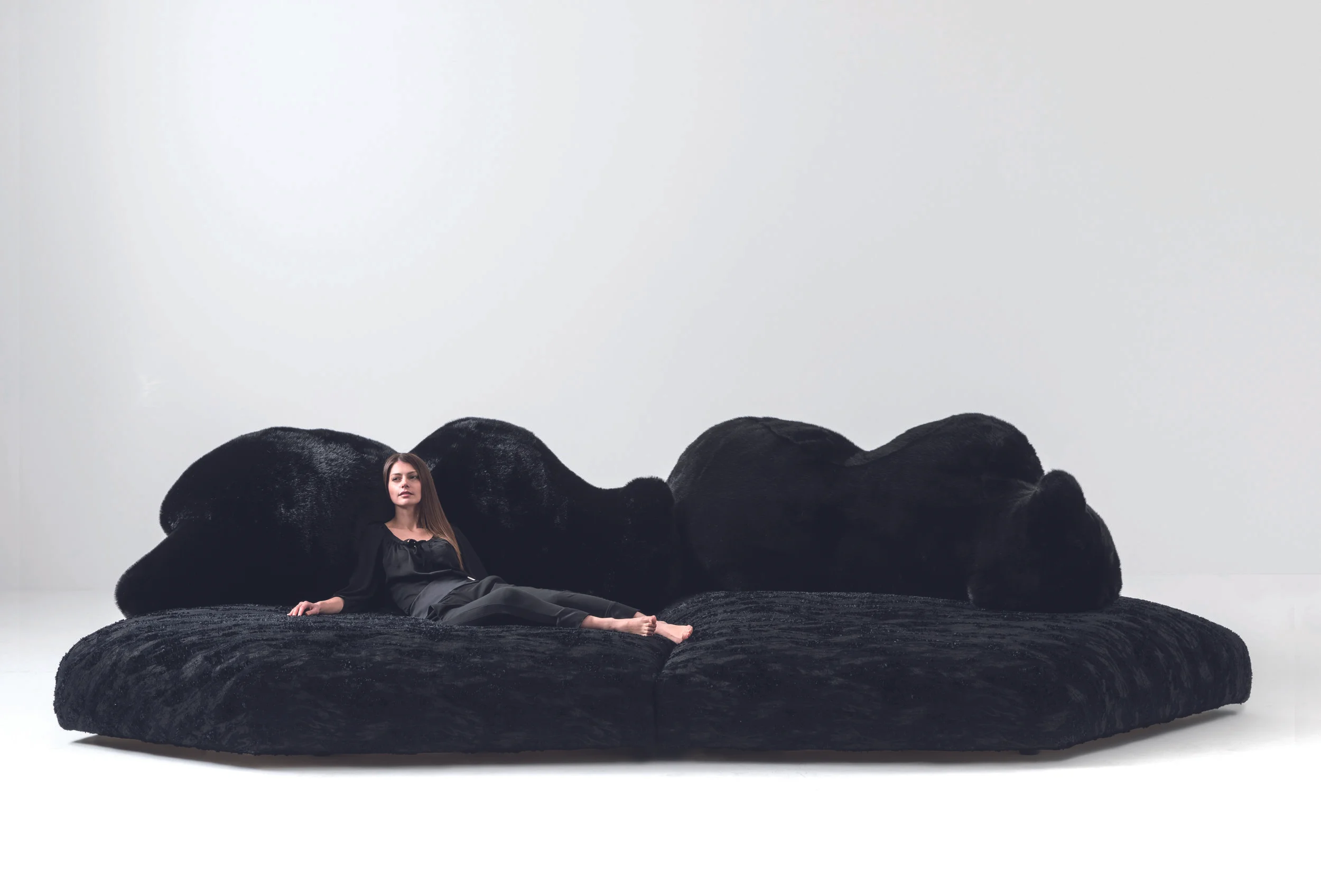 Manufactured by Edra, the Pack and Chiara sofa features both a polar bear and a black bear and provides a landscape for lounging.