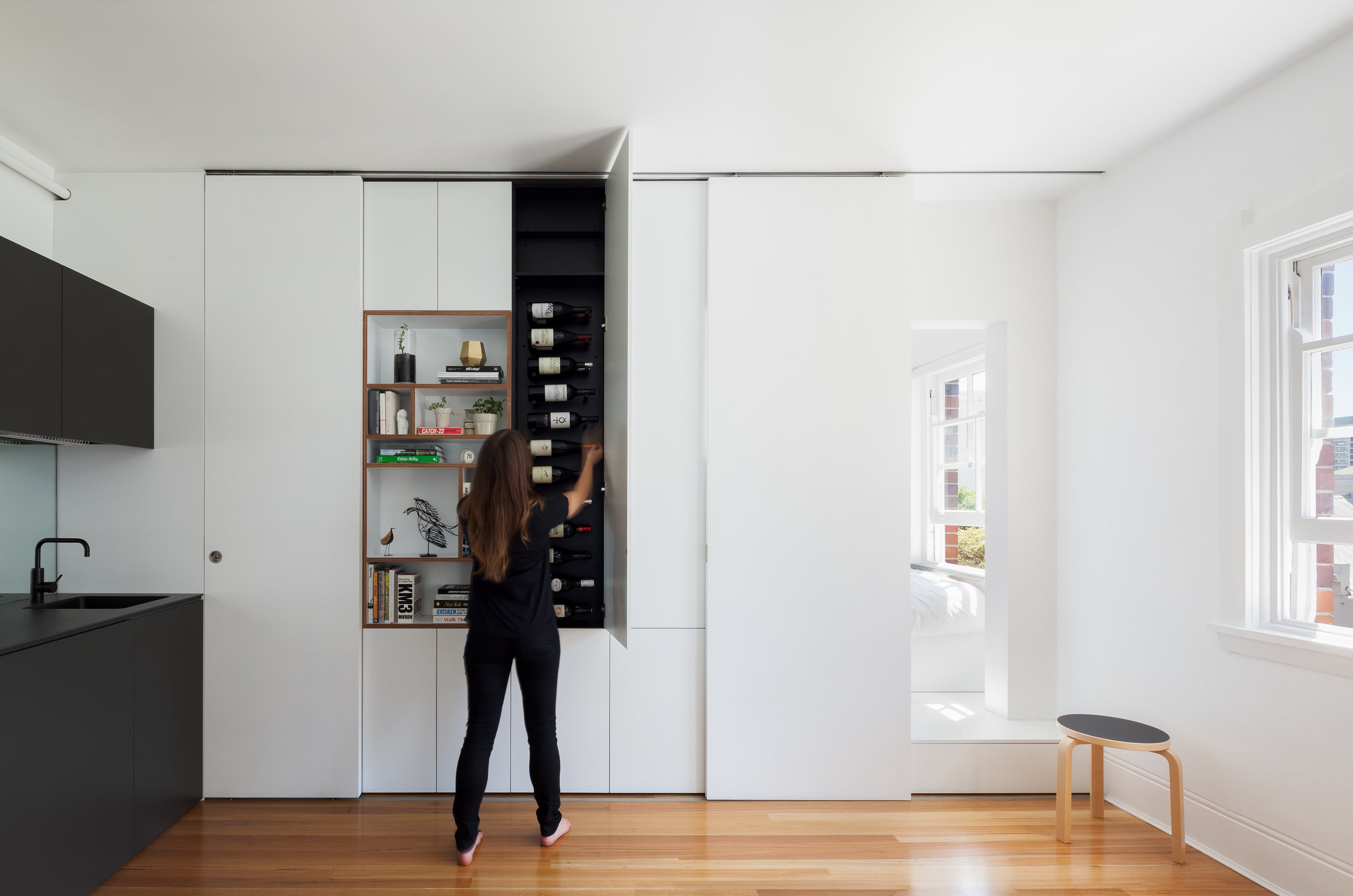 Small is not about compromise, even a 27 square metre apartment can accommodate wine storage if you think creatively. Photo by Katherine Lu.
