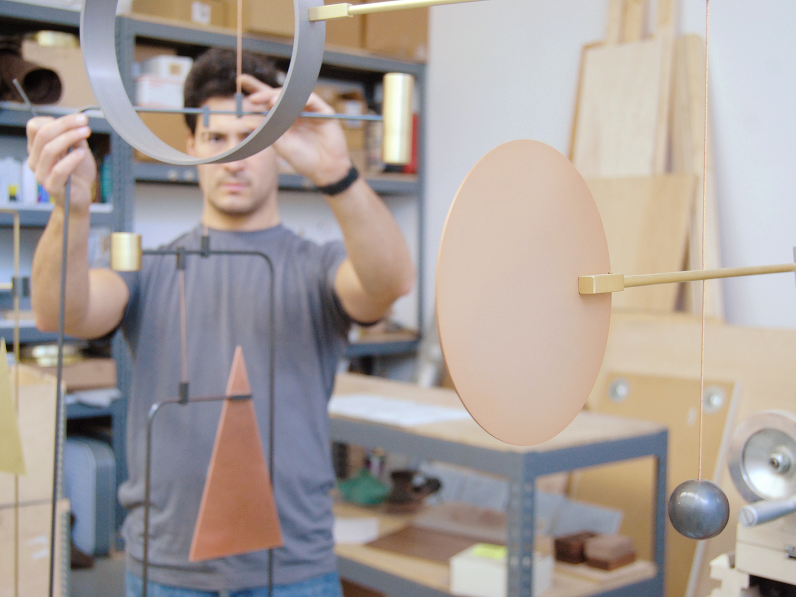 Dylan Davis connecting the many elements of the Point Counterpoint Mobile C inside their Brooklyn studio. Photo L&G Studio.