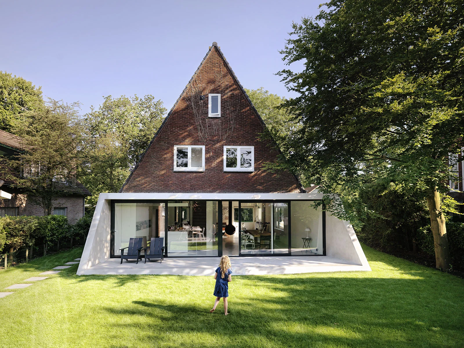The SH House in Amsterdam was all about connecting with the garden, maintaining the overall shape and integrity of the original building while creating an open floor plan that focuses on views outside.