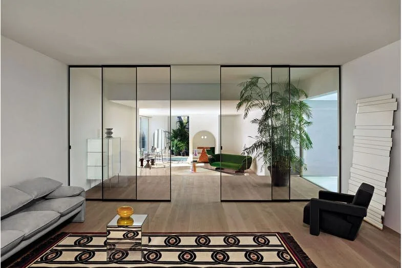 The Sherazade glass sliding door collection designed by Piero Lissoni plays with the effect of light, colour and transparency. Photo c/o Glas Italia.