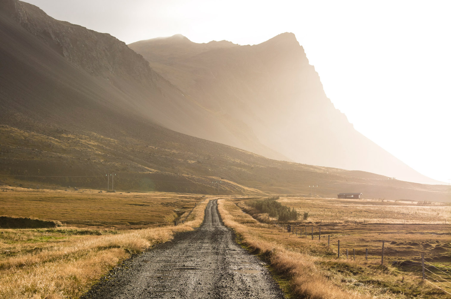 A pulled back version of the same mountain, with a rural road for context.