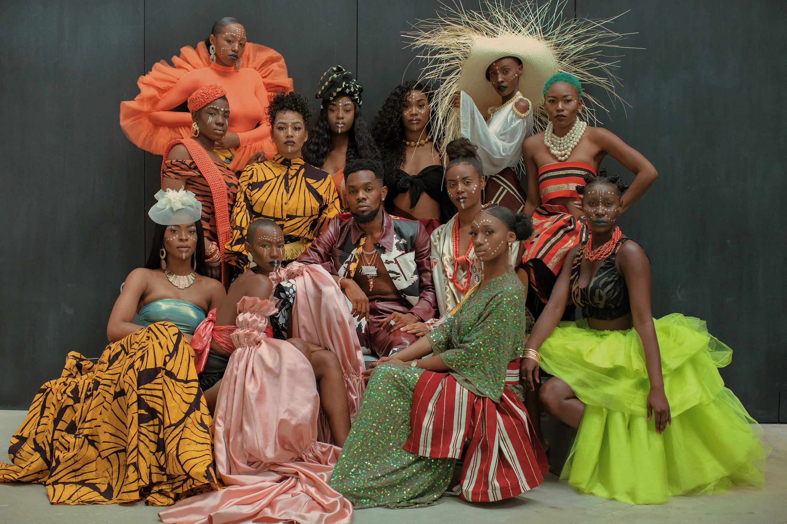Patoranking wearing Tolu Coker, models wearing FordamRowe, Studio 189, Eki Orleans, and Taylor Goldenberg
