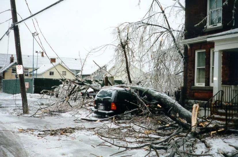 A smashed van in the aftermath of the 1998 ice storm. Bill Stevenson via Flickr , shared with a CC BY-NC-SA 2.0 license .