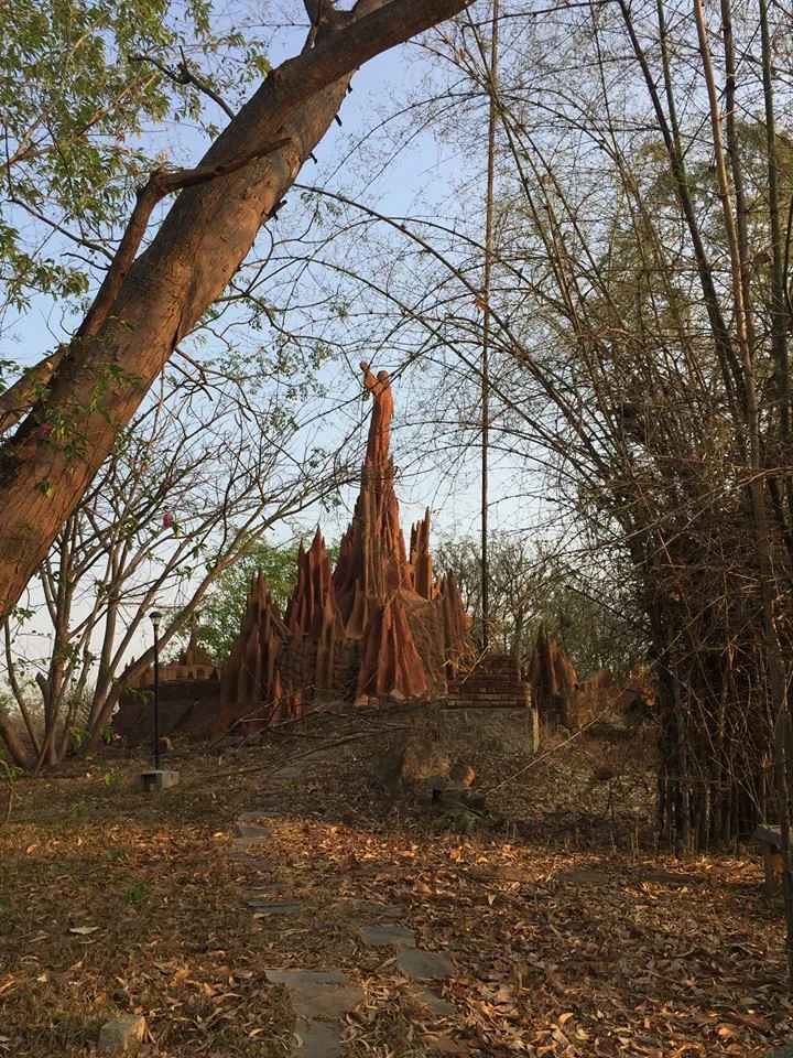 Chapel, exterior. Designed to look like one of the many anthills in the region and to evoke the sage Valmiki, author of the Ramayana, around whom huge anthills formed while he sat in samadhi.