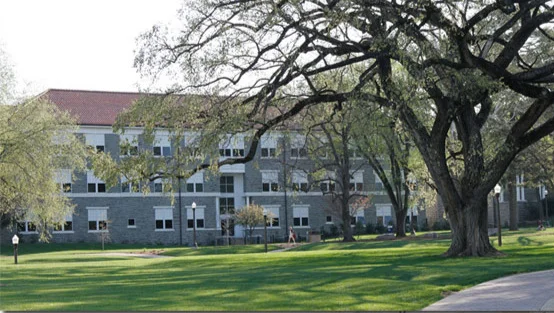 The Music Building is centrally located between the Mason Street parking deck and the Warsaw Street parking deck. Visitors can park without a pass and free of charge beginning at 3 pm on Fridays. Be sure to enter the Mason Street parking deck at Mason Street. Additionally, there are 2 metered spaces as well as handicap parking in a small lot adjacent to Main Street at the Music Building.