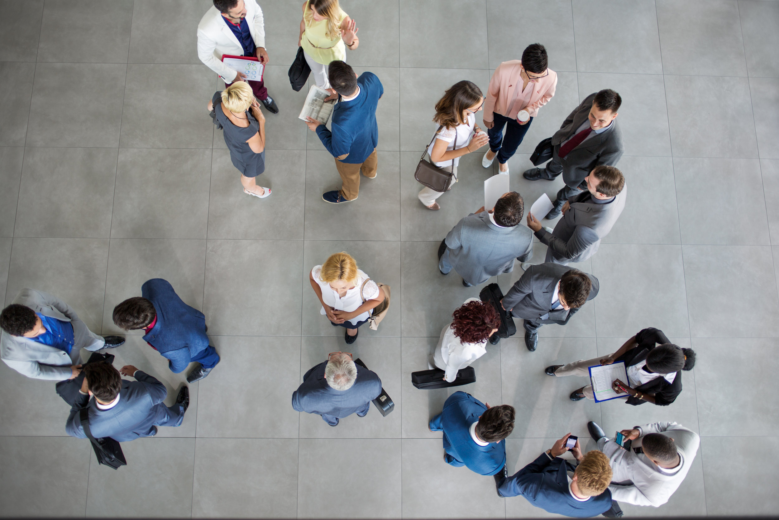 people standing and talking on business meeting.