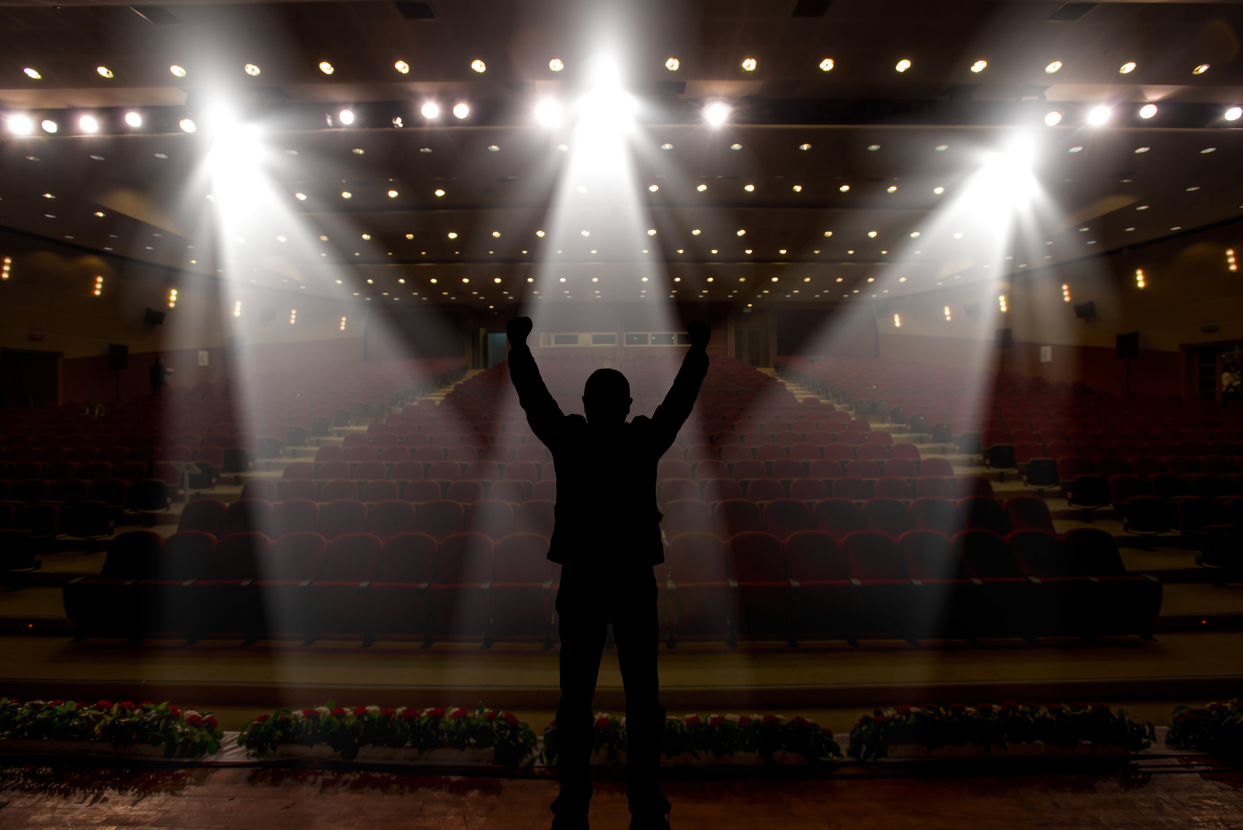 Silhouette of actors in the spotlight