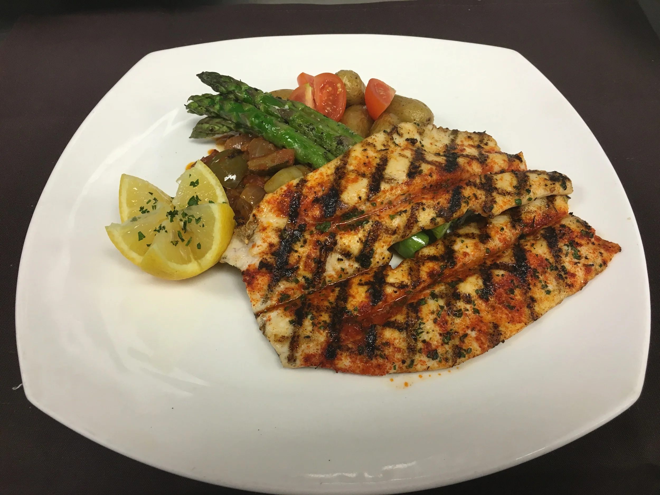 Blackened trout with asparagus, fingerling potatoes, ratatouille