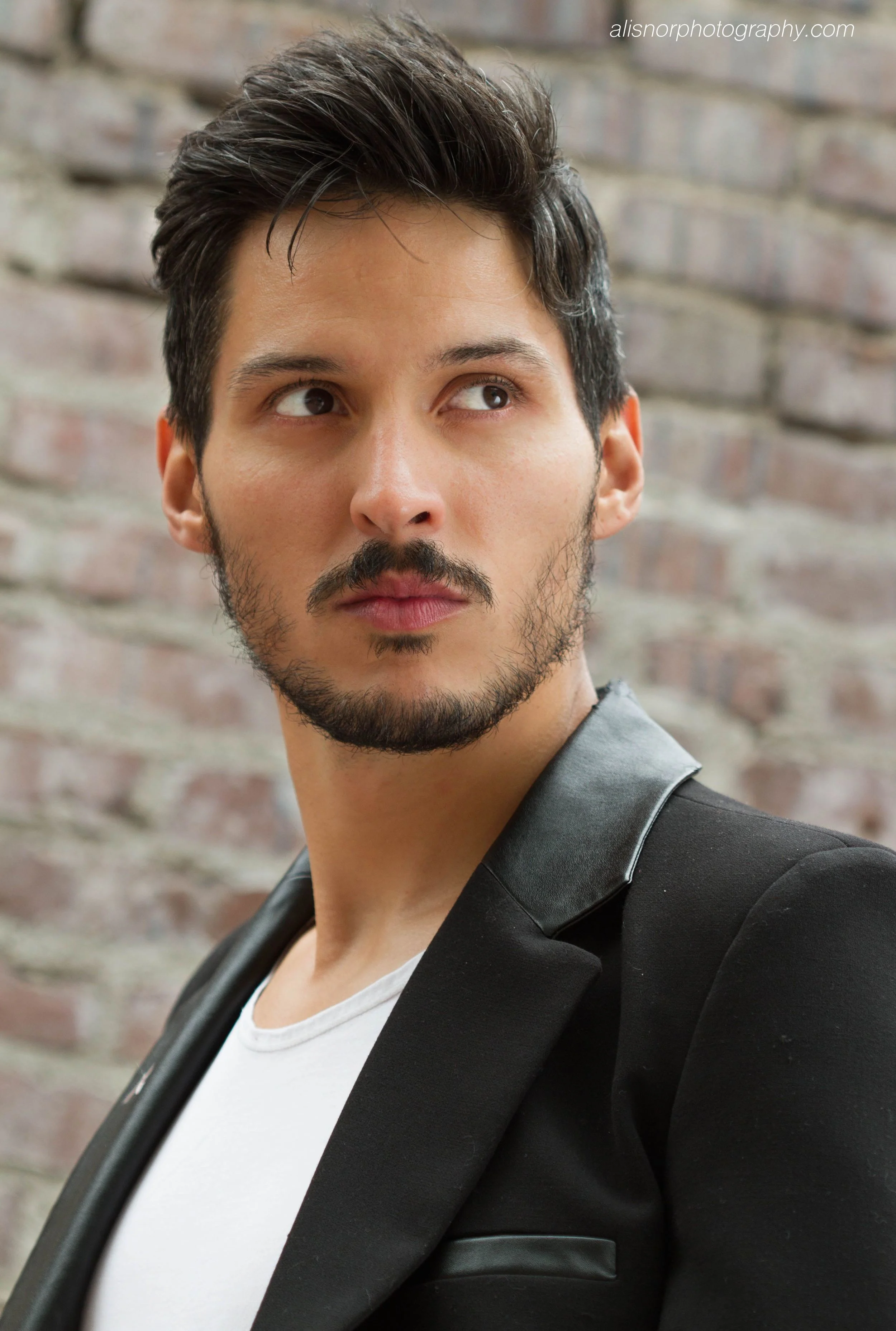 Manuel Castillo Black leather 2t side eye LR wm.jpg