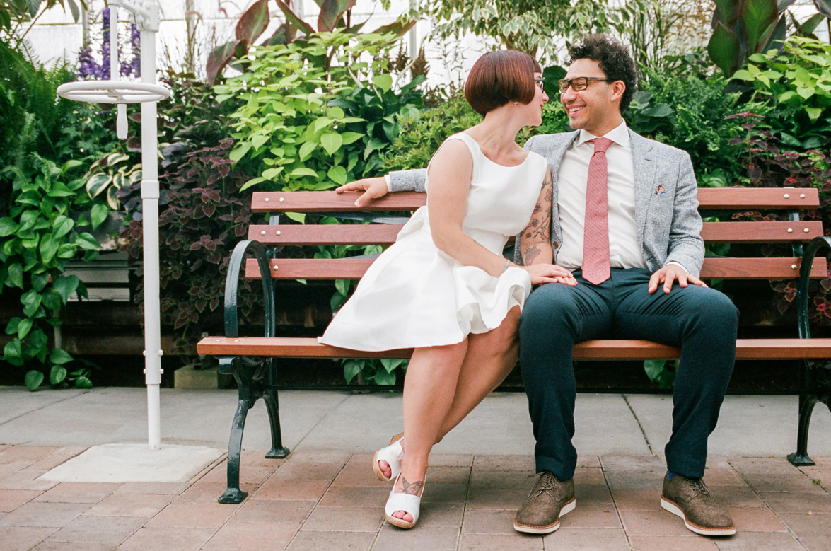 Bride and Groom Portraits at a Volunteer Park Conservatory Wedding with the bride wearing Kate Spade. 