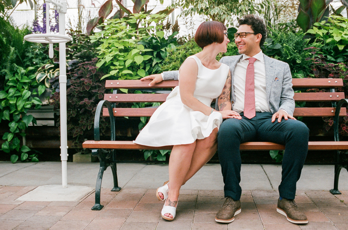 Bride and Groom Portraits at a Volunteer Park Conservatory Wedding with the bride wearing Kate Spade.
