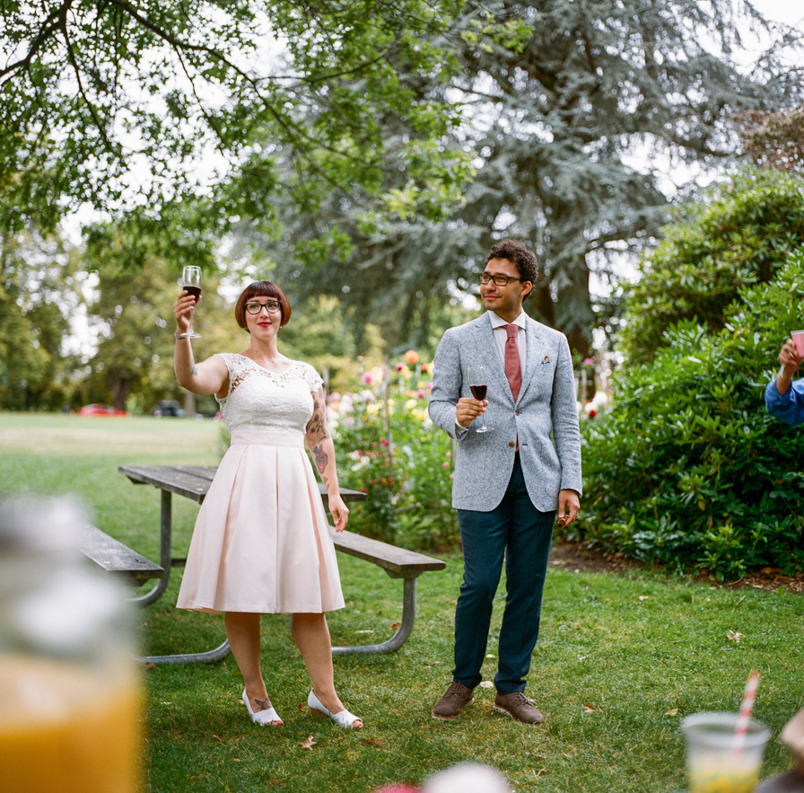 Toasts in the park from a Volunteer Park Conservatory Elopement.
