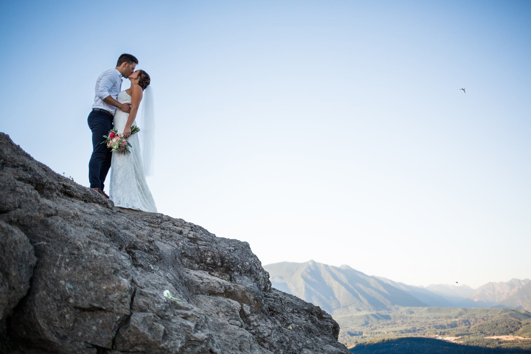 Bride and groom at Rattlesnake Ledge by Alexandra Knight Photography.