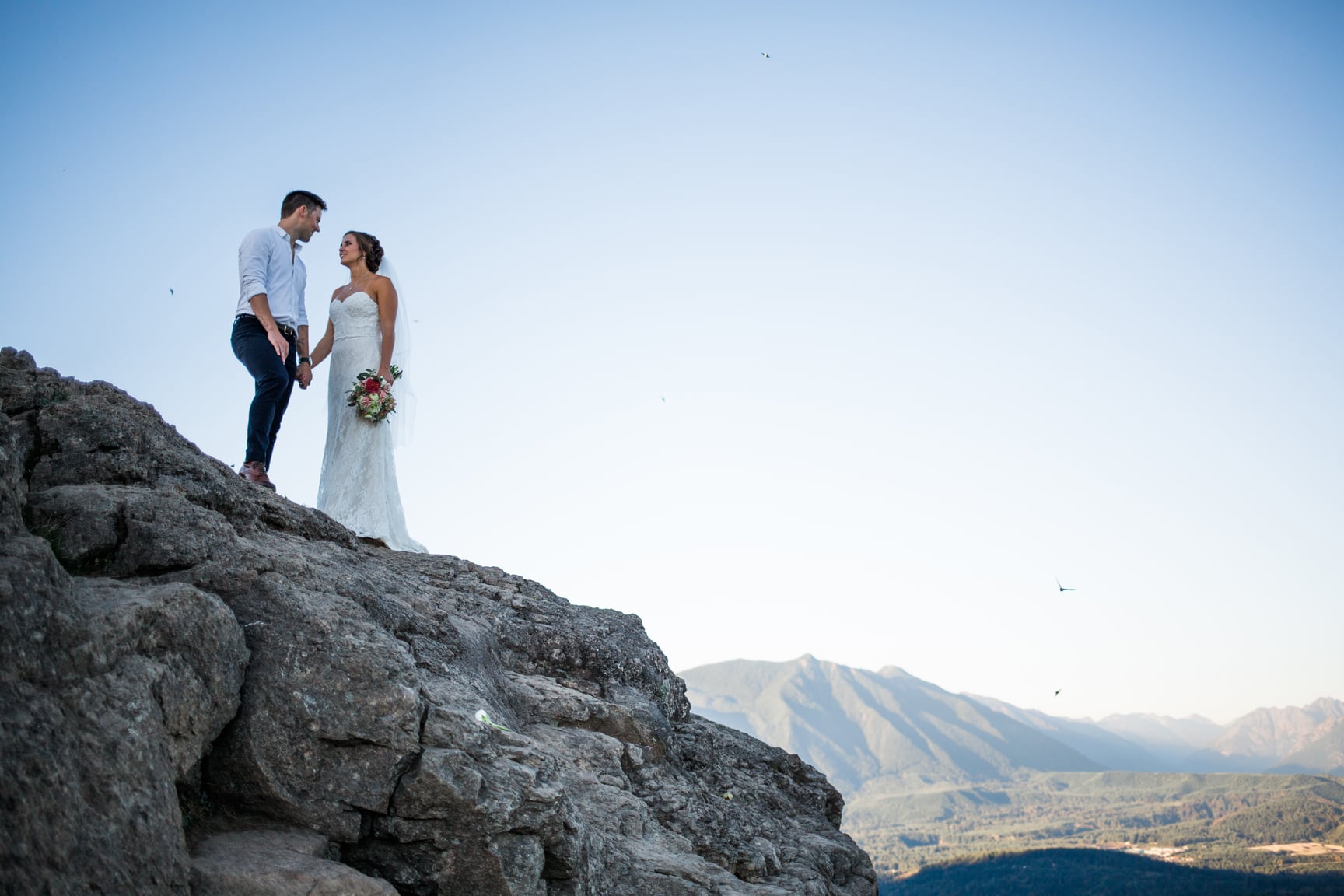 Bride and groom at Rattlesnake Ledge by Alexandra Knight Photography.