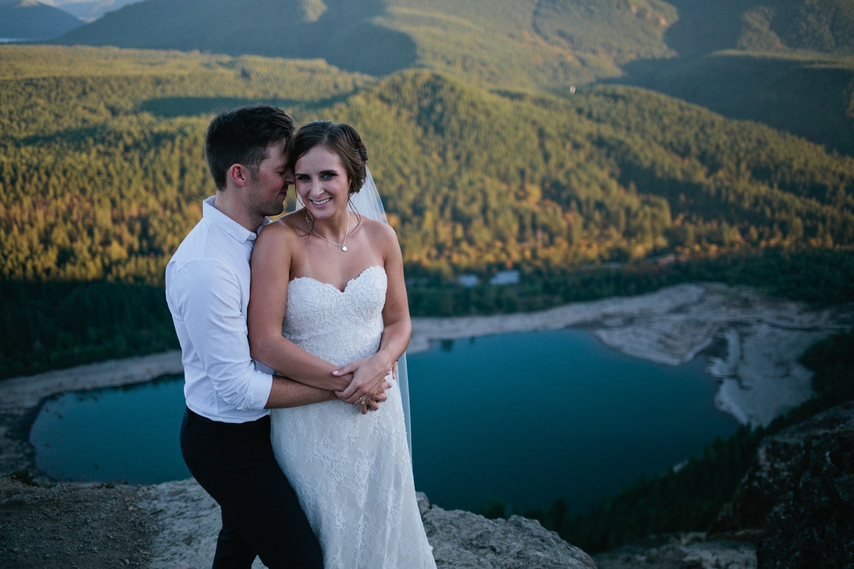 Bride and groom at Rattlesnake Ledge by Alexandra Knight Photography.