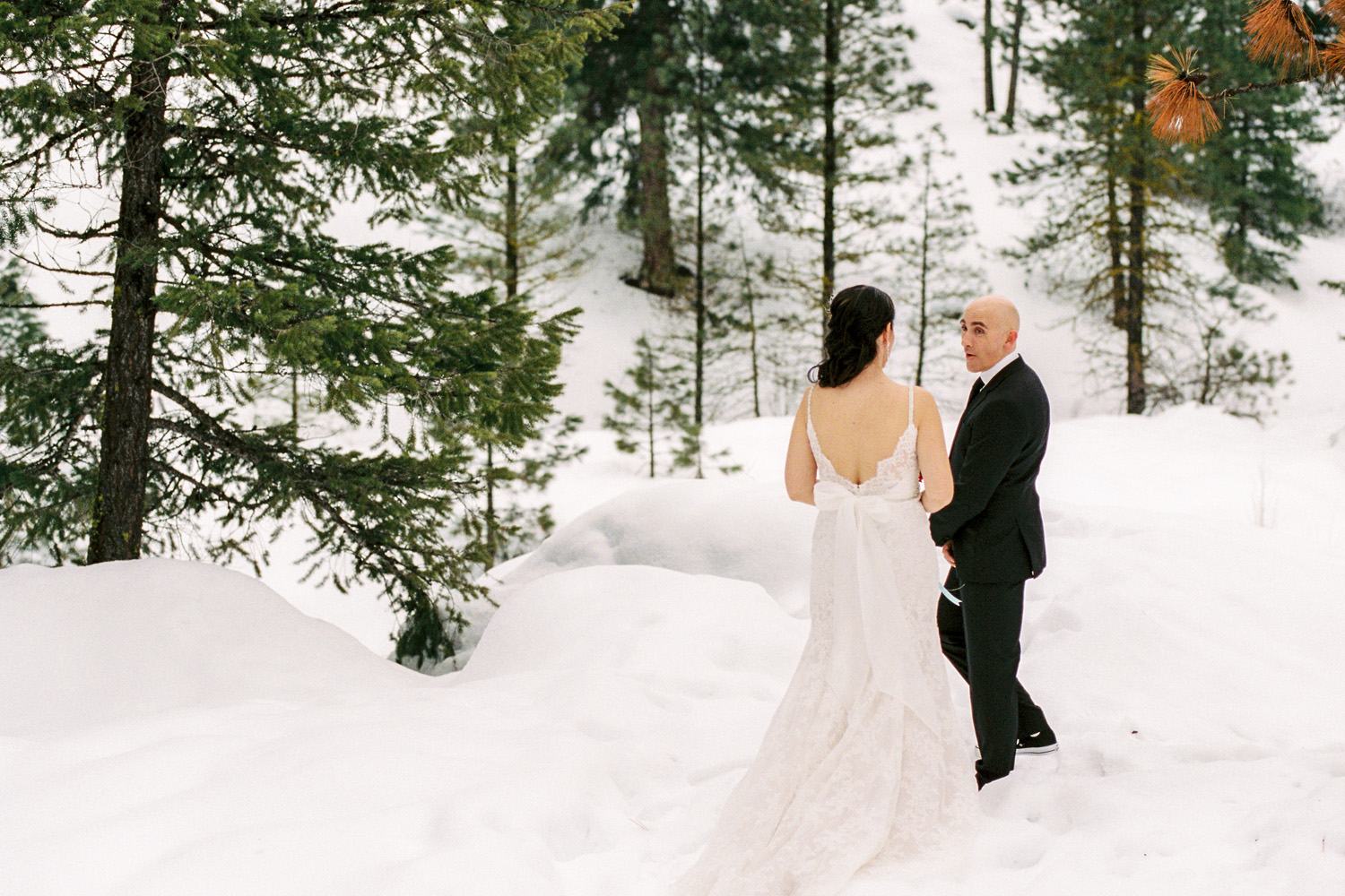 Sleeping Lady Mountain Resort in Leavenworth Winter wedding photography first look with the bride and groom