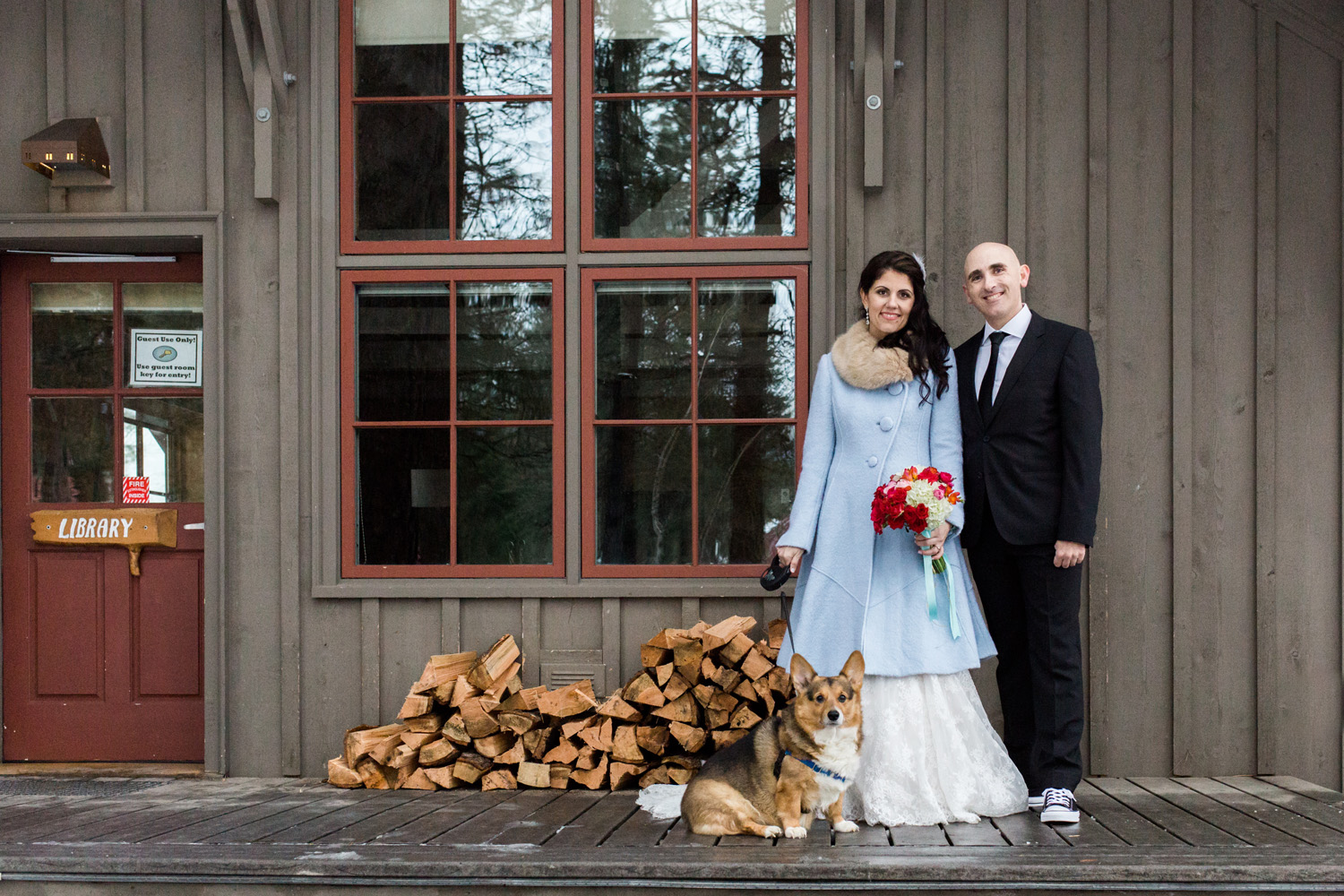 Couple with their corgi at the Sleeping Lady Mountain Resort in Leavenworth Winter wedding photography