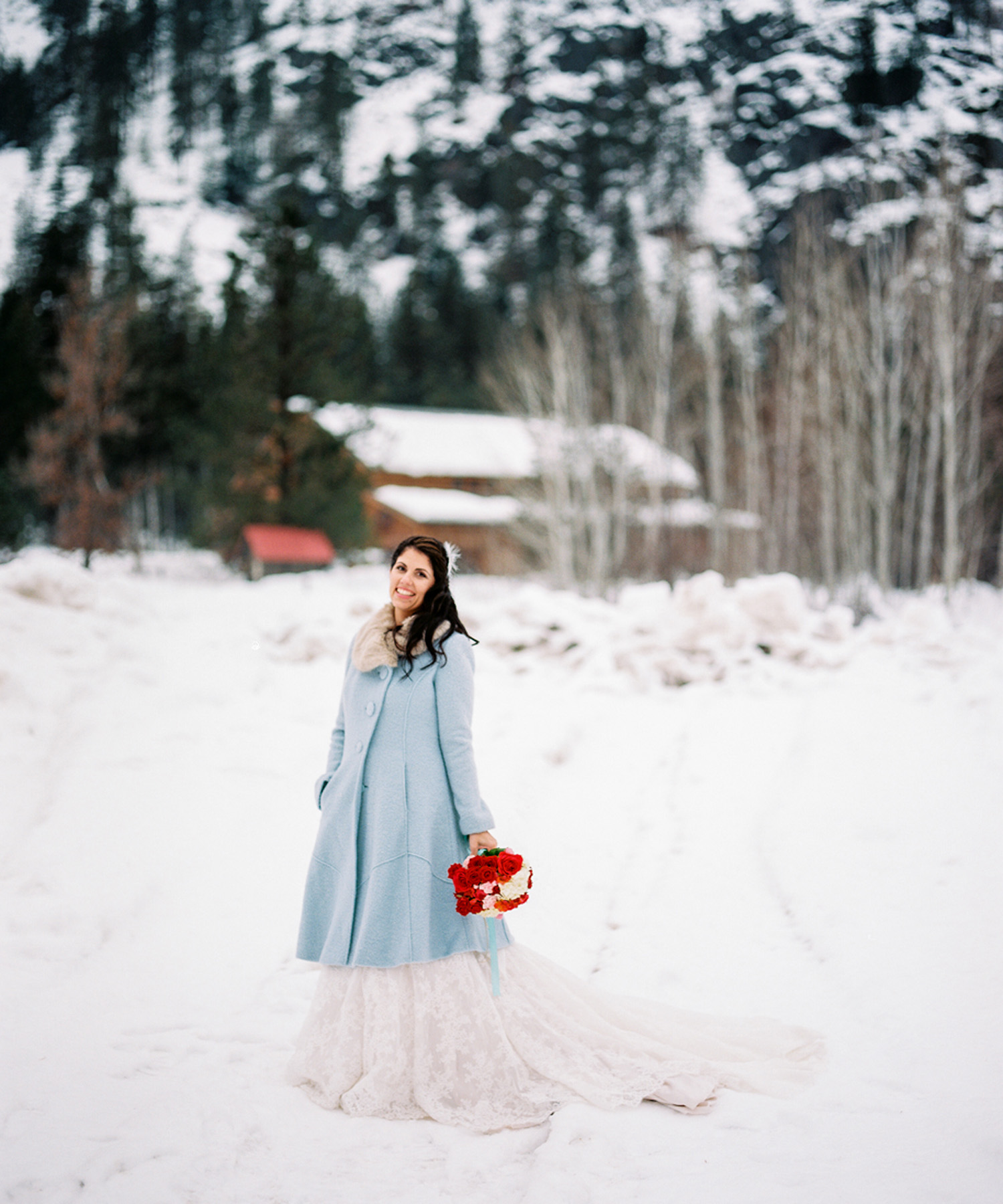 Sleeping Lady Mountain Resort in Leavenworth Winter wedding photography with a baby blue pea coat