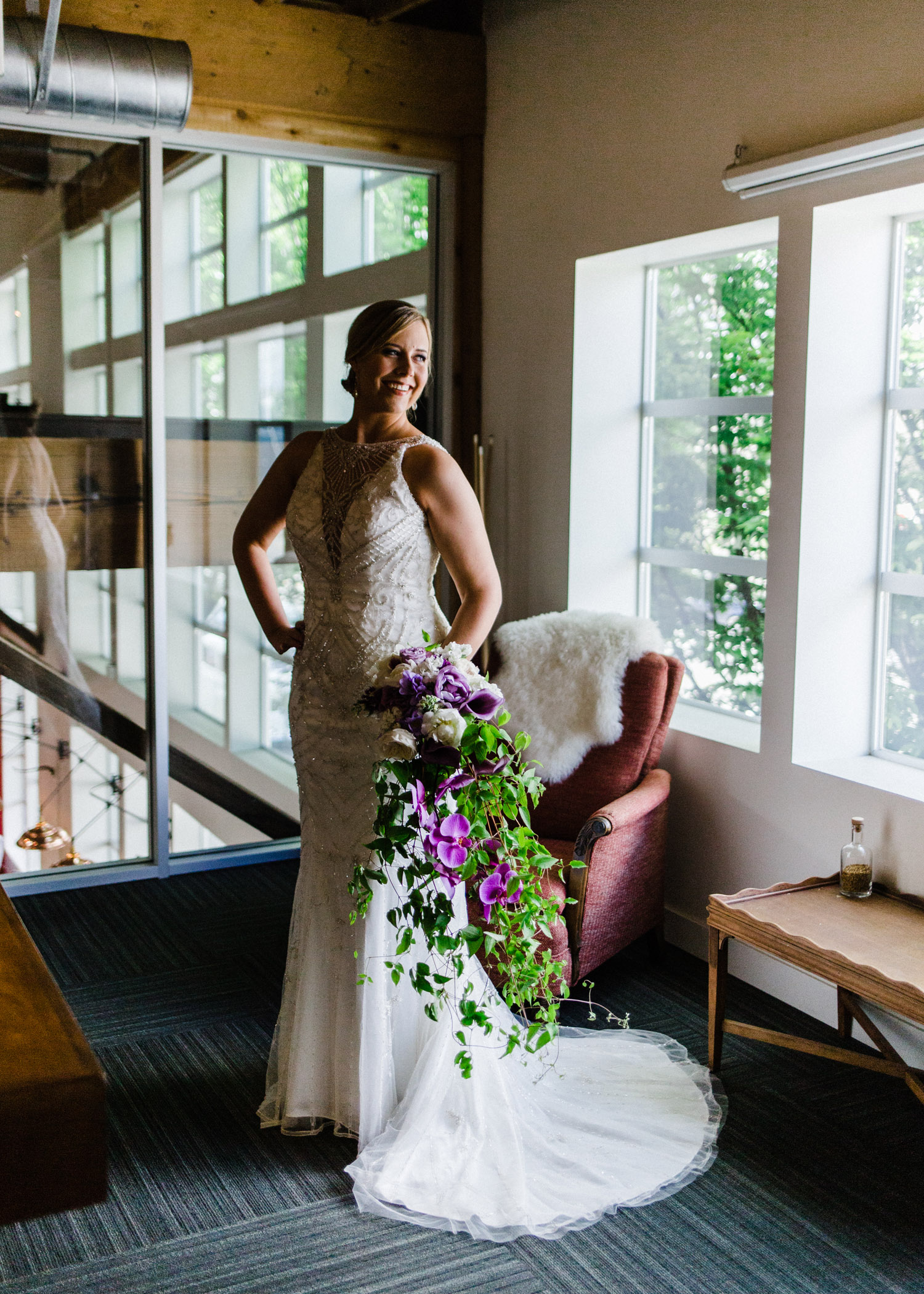 Bride with Cascading Flower Bouquet at Westland Distillery by Alexandra Knight Photography Seattle Wedding Photographer