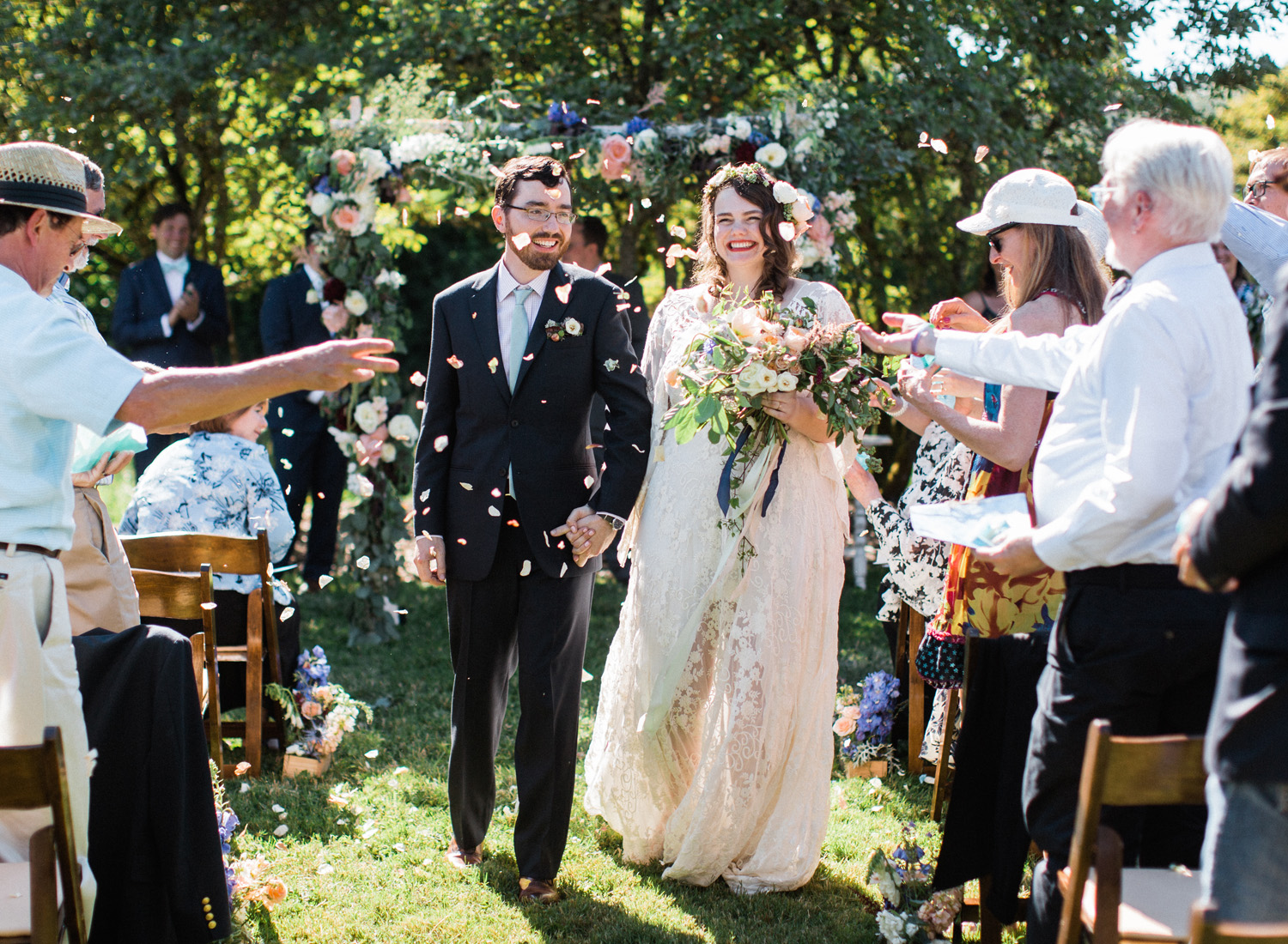 Seattle bride and groom wedding ceremony recessional with a petal toss