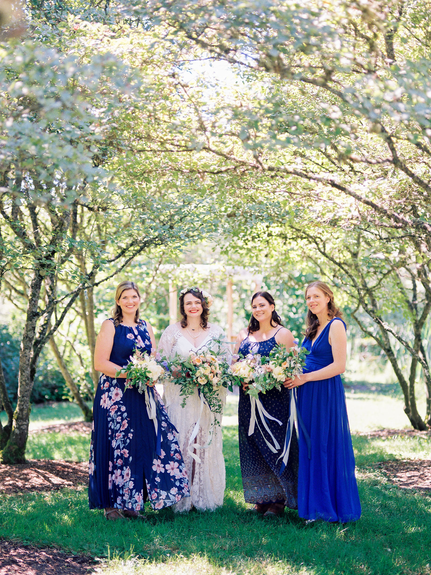 Bridesmaids in mismatched blue dresses Seattle University of Washington wedding