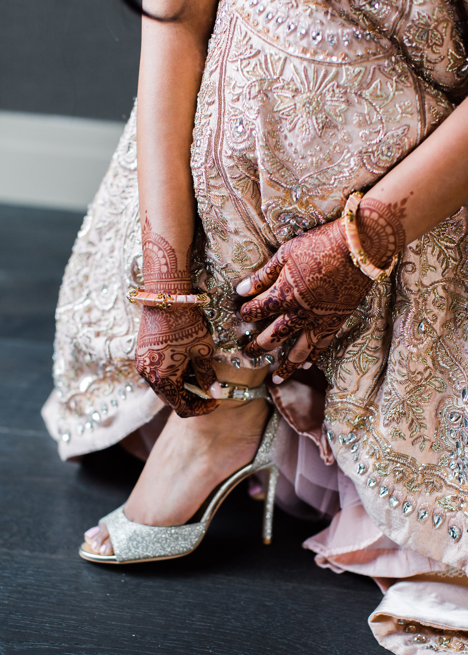 Alexandra Knight Photography Seattle Indian Wedding Photographer bride getting dressed blush pink lehenga and henna tattoos.jpg