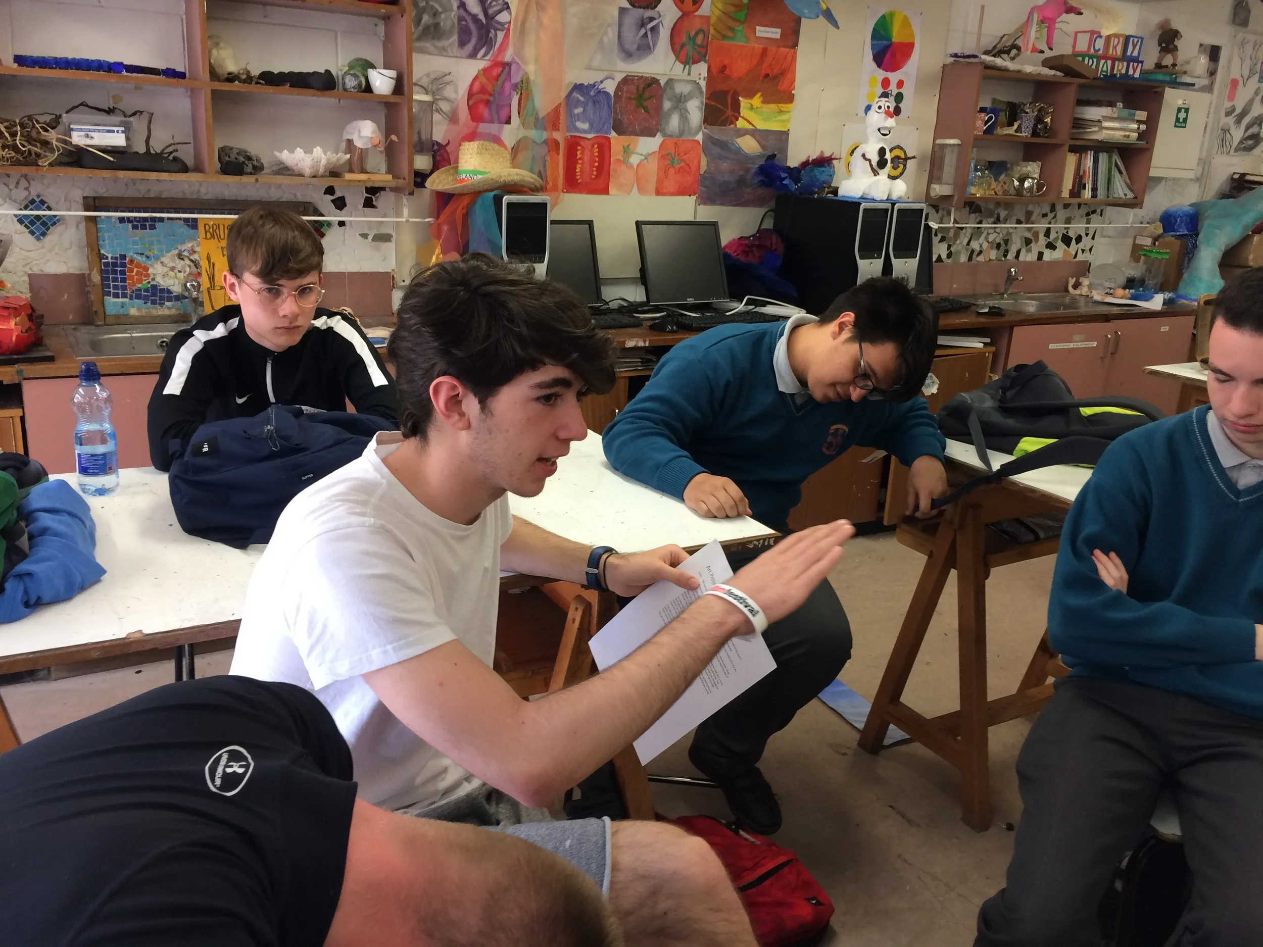 Student reads his proposed script The Butterfly Effect to the other students for feedback