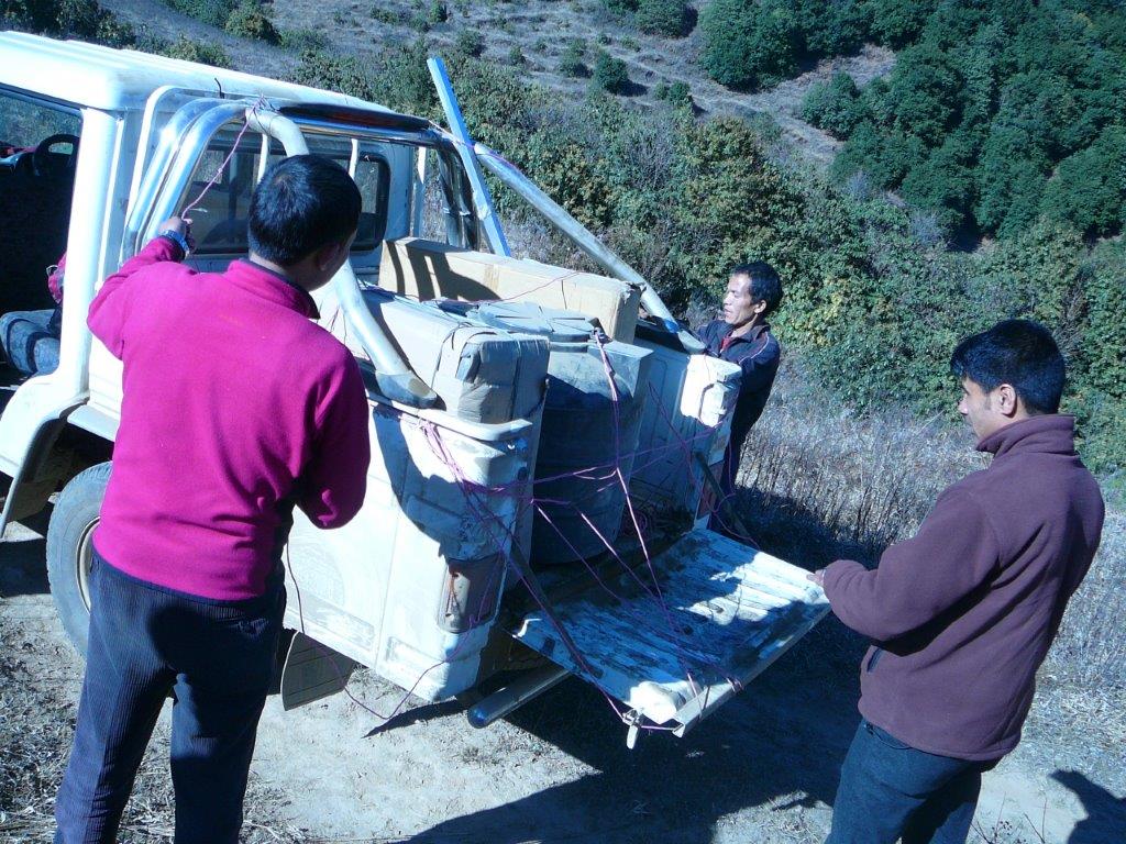 Unloading equipment to potter to Pasavar village.jpg