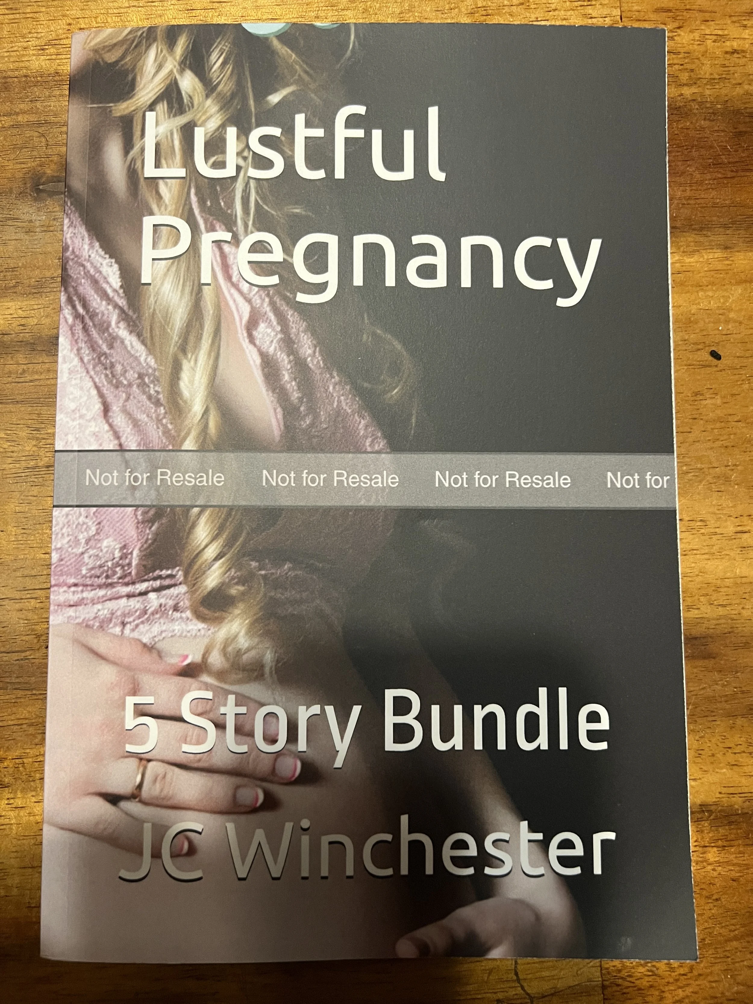 Picture of a copy of Lustful Pregnancy in paperback form.