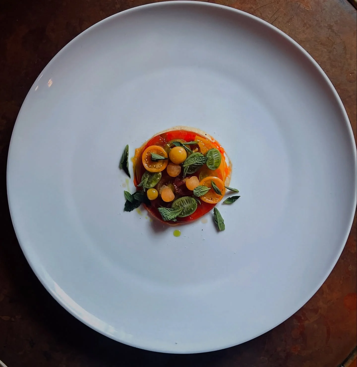 LATE SUMMER TOMATOES

multicolor heirloom tomatoes + gooseberries + cantaloupe baubles + sundried tomato consomme