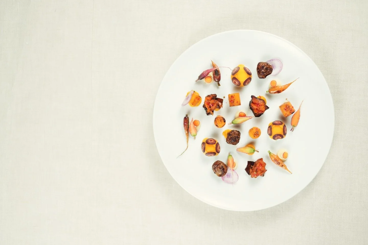 WINTER VEGETABLE LANDSCAPE 
scattered caramelized squash domes &amp; glazed roots