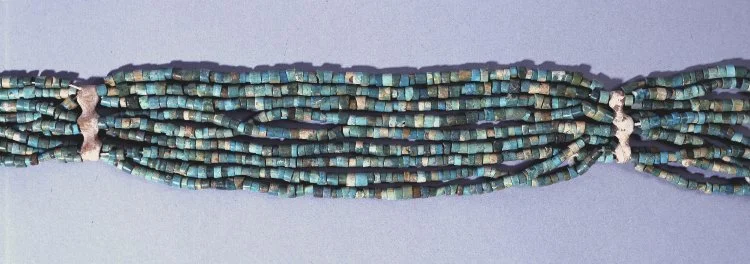 Beaded girdle found over the knees of the male corpse in Grave 592 at Mostagedda in Egypt, ca. 4000 BCE. While the small beads are glazed steatite, the spacers are bone. The girdle is preserved at the British Museum as Cat. No. EA62150. Image courtesy Trustees of the British Museum. 