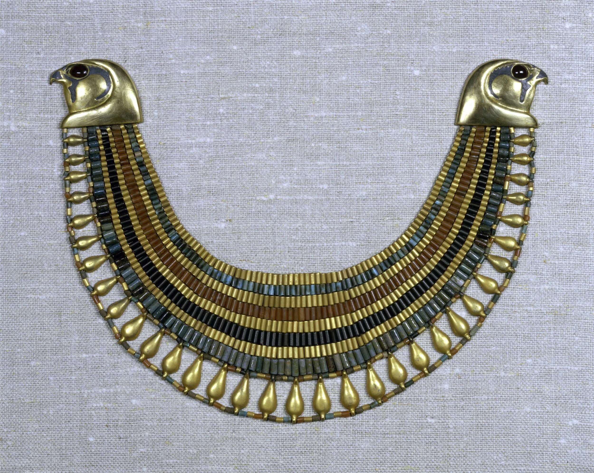 The beaded broad collar of Senebtisi (ca. 1850-1775 BCE), made to fit the nape of the neck thanks to 2-dimensional contouring of the sort already present in Egypt by ca. 2500 BCE. Made of gold, carnelian, turquoise and faience, the collar is preserved at the Metropolitan Museum of New York as Accession No. 08.200.30. Image courtesy Metropolitan Museum of Art, New York. 